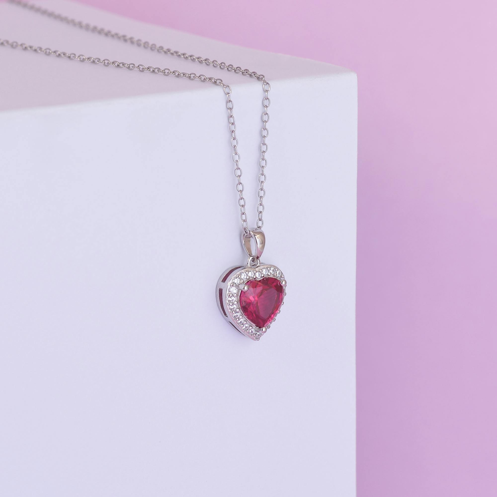 Elegant heart-shaped gemstone pendant necklace in silver, perfect for romance.
